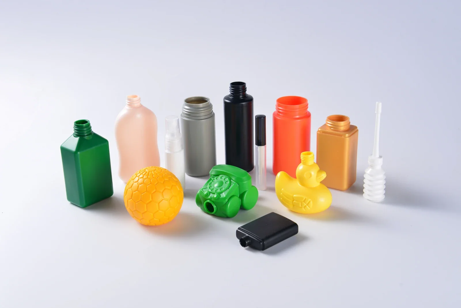 Colored shaped container samples including rectangular and novelty forms