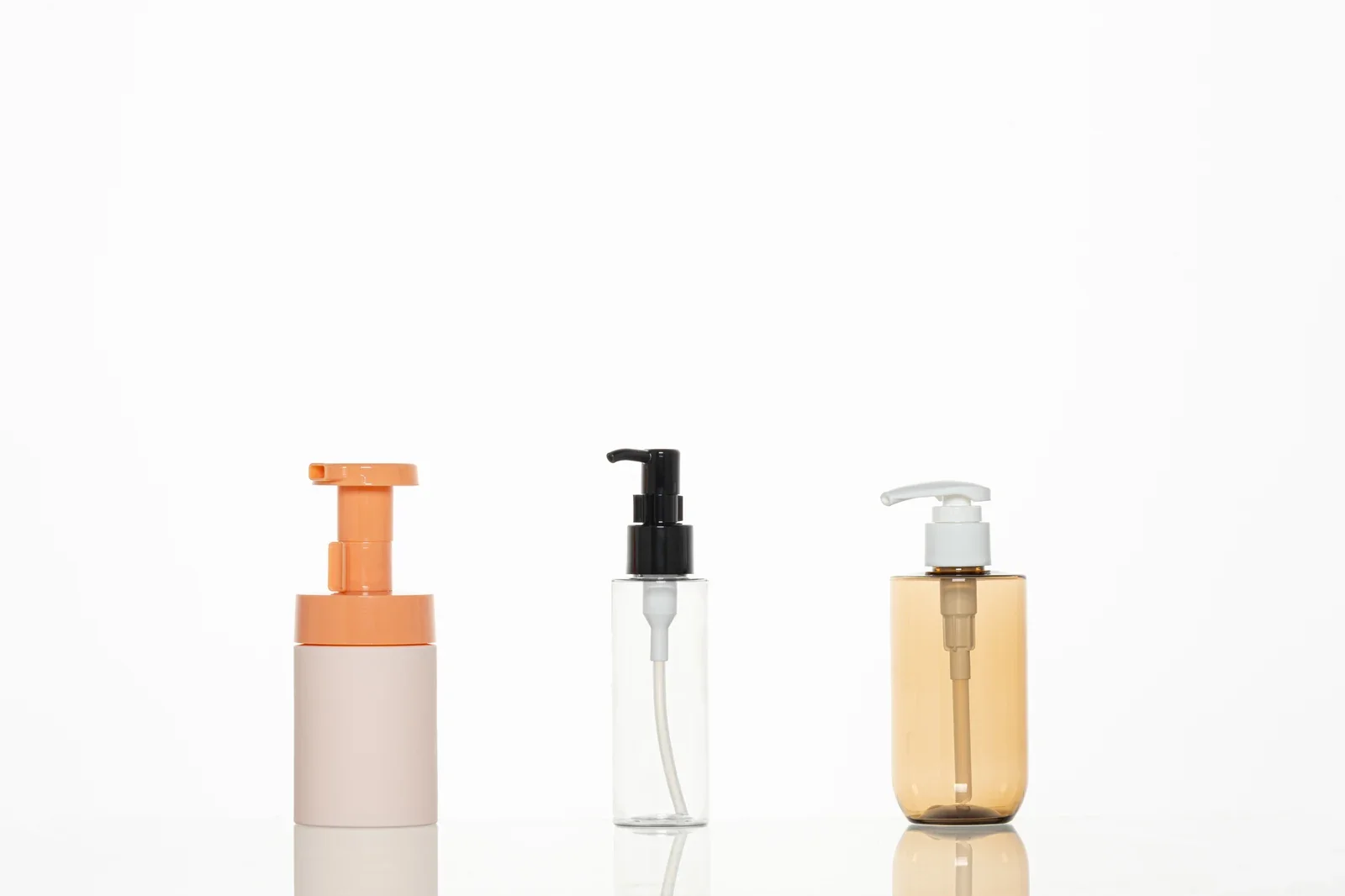 Three bottle samples fitted with foam and lotion pumps
