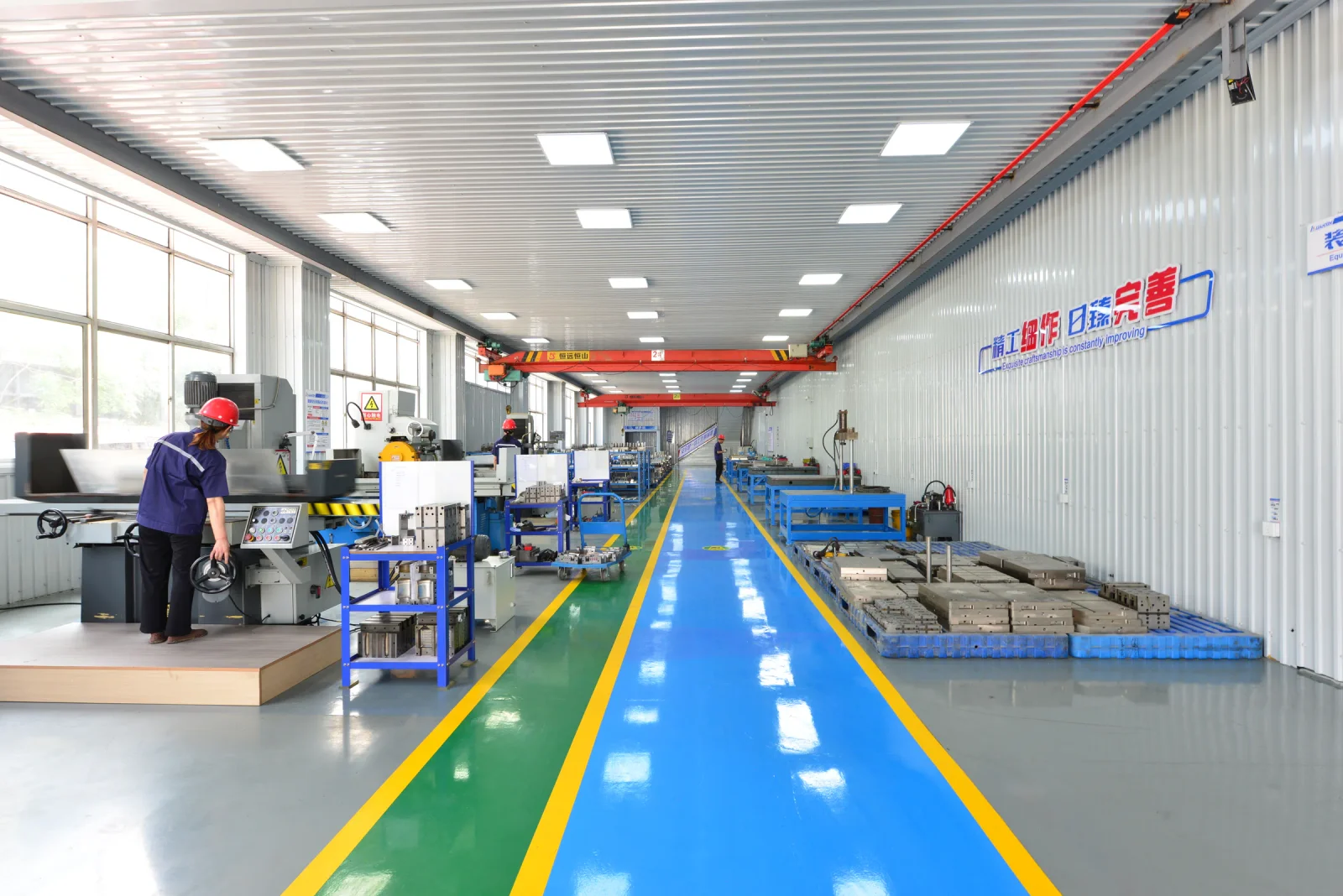 A LIANXIN team member working in the precision machining area
