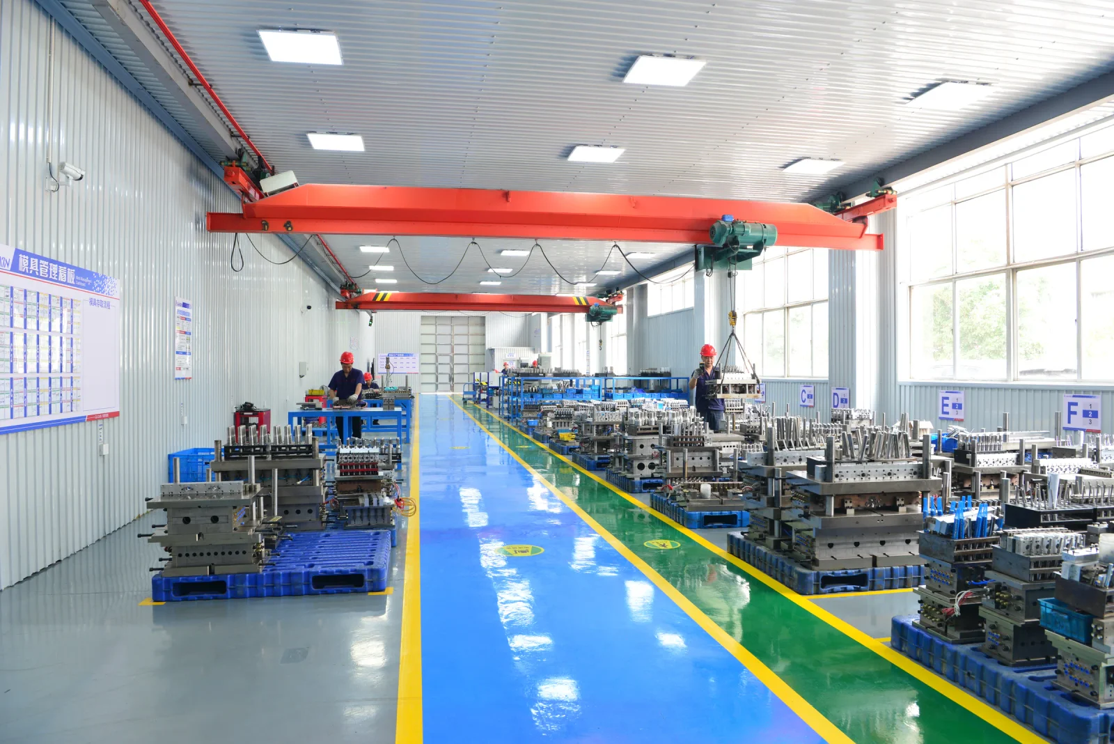 Molds and team members inside the LIANXIN mold workshop