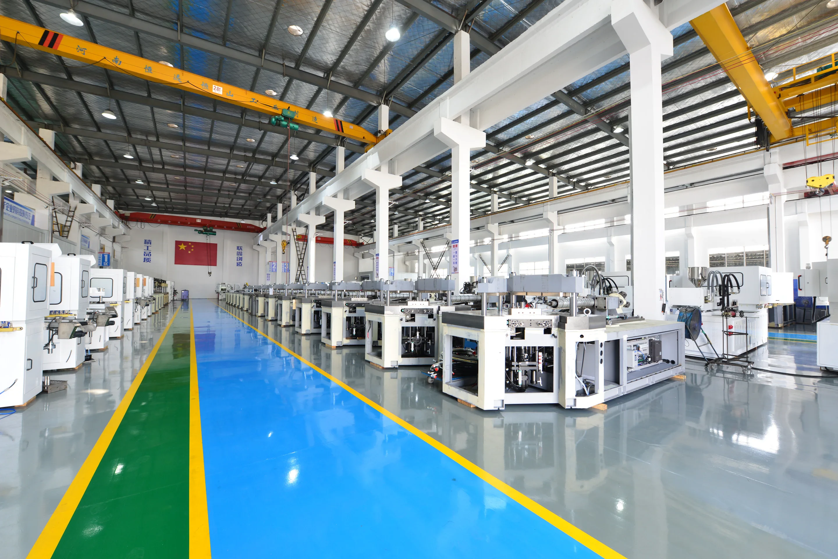 LIANXIN injection blow molding machines on the factory assembly floor