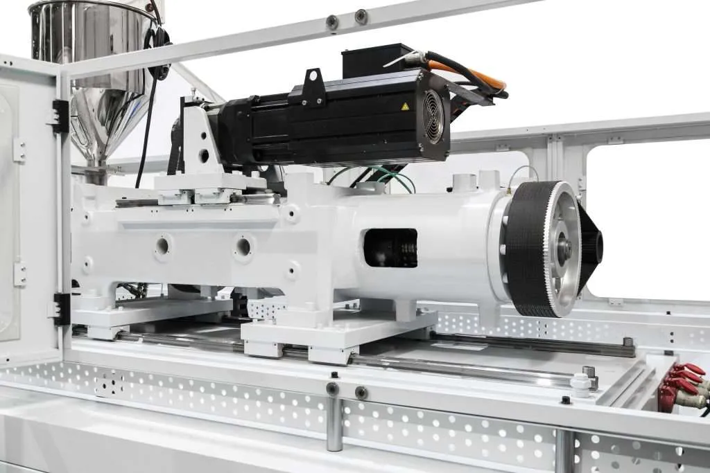 Servo motor and electric drive assembly inside a LIANXIN IBM-E injection blow molding machine